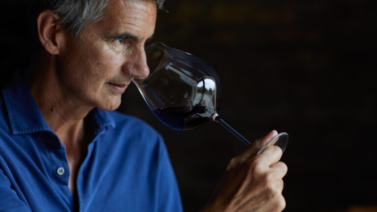 Man smelling wine in a glass
