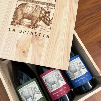 wooden box with three bottles of wine in it